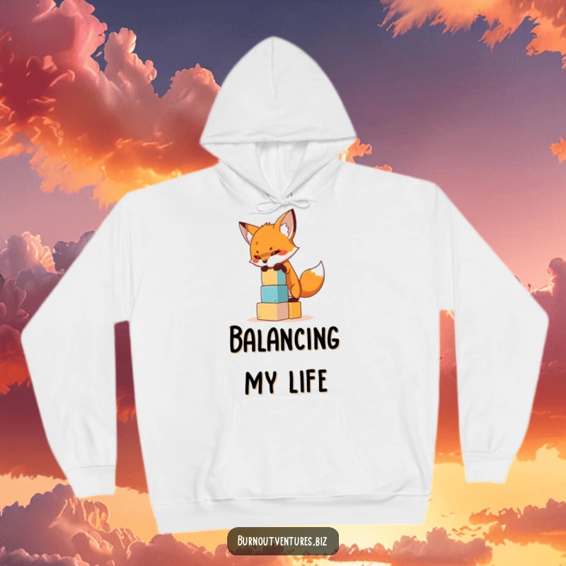 Funny hoodie depicting a concentrated fox attempting to balance a small stack of building blocks, a humorous moment of focus.